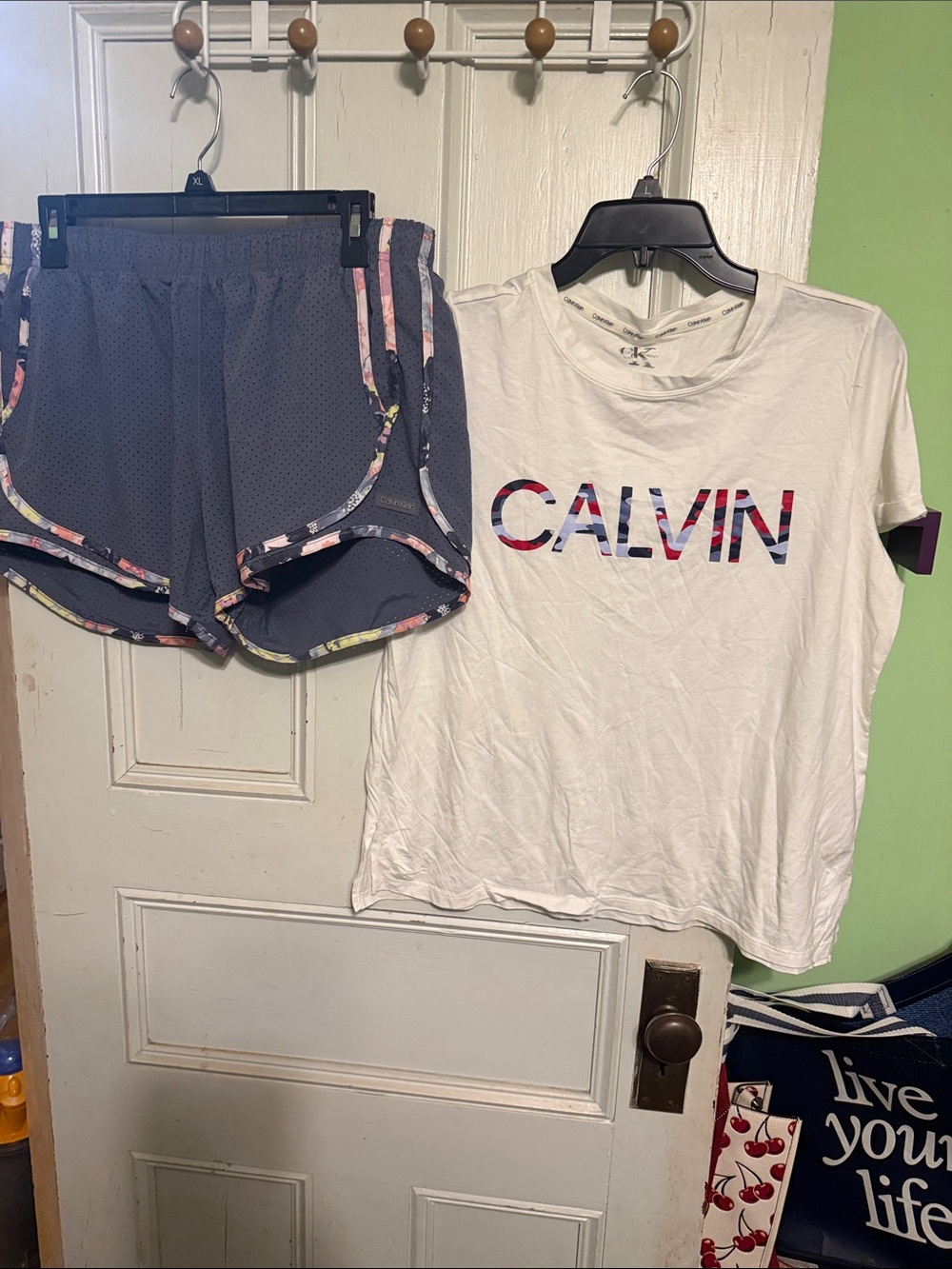 Calvin Klein White Logo Tee with Navy Shorts and Floral Trim